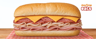 The All American sandwich featuring ham, turkey, salami with American cheese on a split-top hoagie