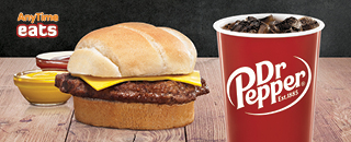 Cheeseburger sandwich with melted cheese on beef patty and a small Dr. Pepper fountain drink
